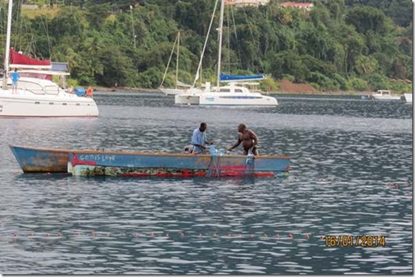 blogFishing by the yachts, morning at Roseau