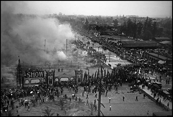 Mar. 5, 1929:  Overhead view of crowds surrounding the Los Angeles Auto Show grounds as smoke rises from the remains of the tents, 1929 