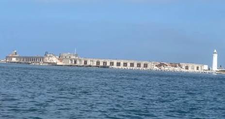 A body of water with buildings in the background

Description automatically generated with medium confidence