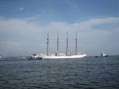 An impressive Spanish ship being tugged out.