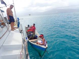 A group of people on a boat in the water

Description automatically generated