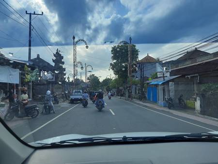 A group of people riding motorcycles down a street

Description automatically generated with low confidence