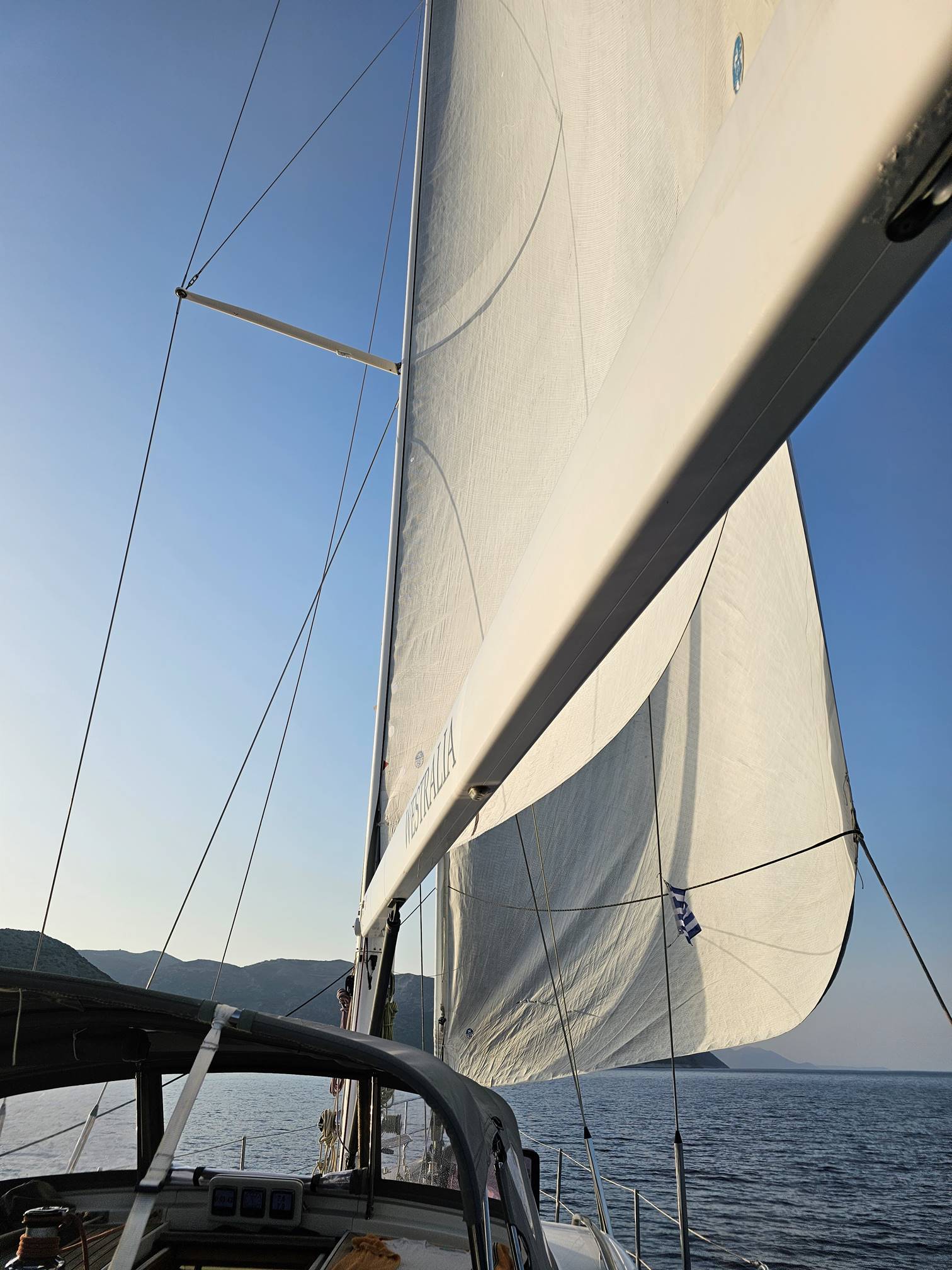A sailboat with a mast

Description automatically generated